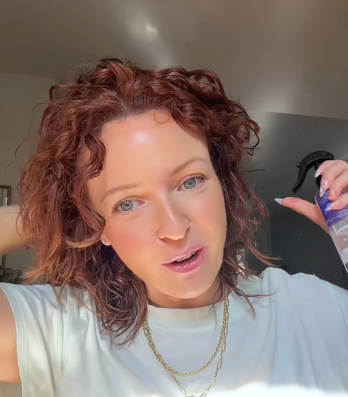Customer applying hair spray