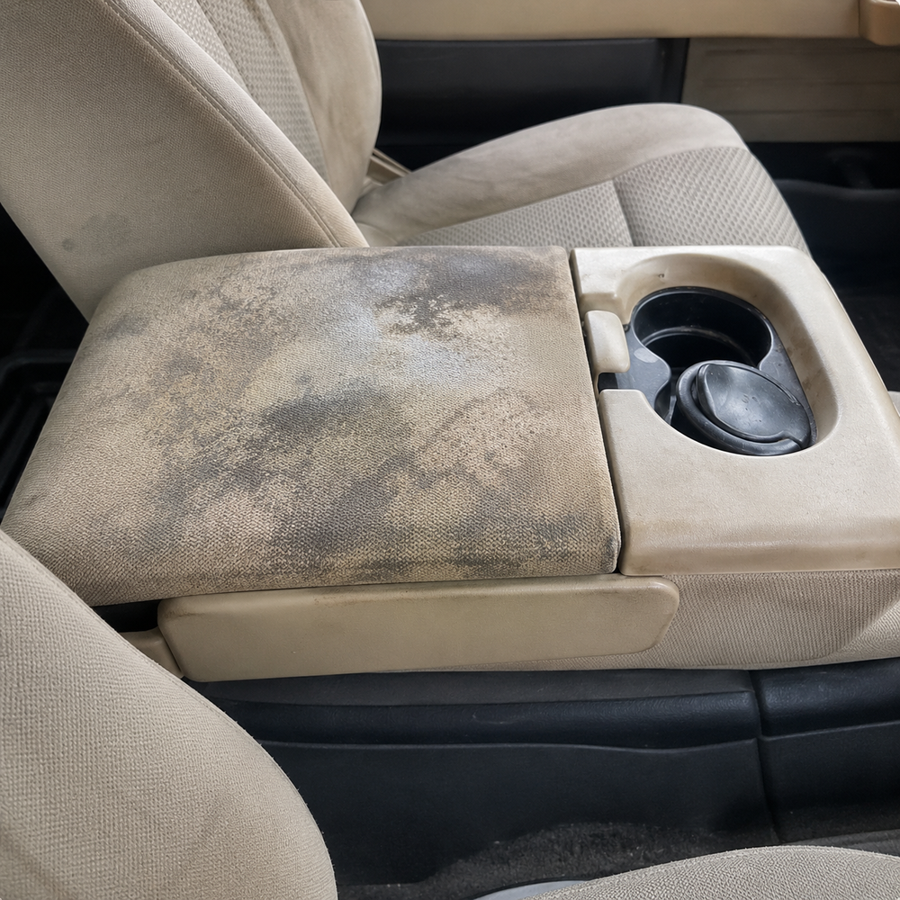 Dirty car armrest before cleaning